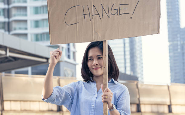 istock Female protestor with a sign of change 1293745729