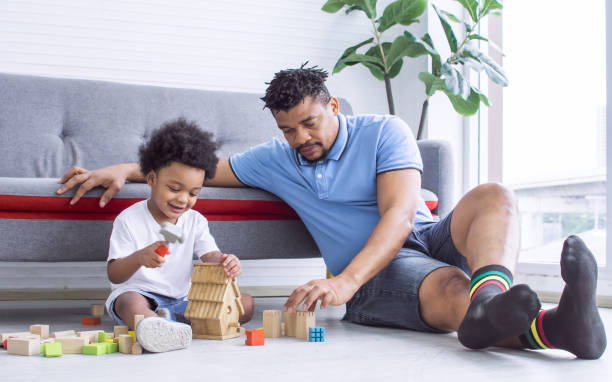 istock African father is playing with his son 1293745822