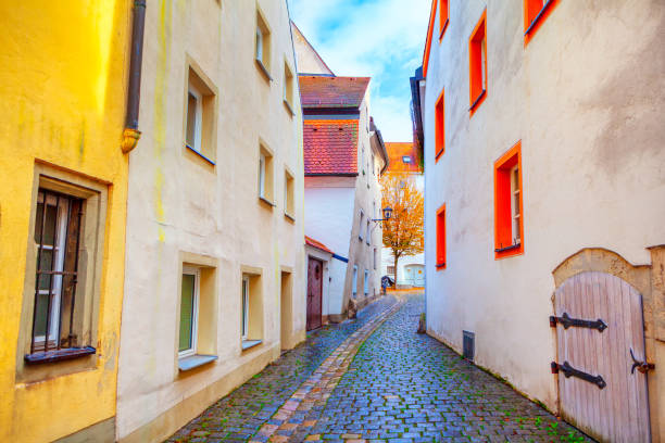Narrow street with cobblestone road . Old town street in Regensburg From Bavaria Germany