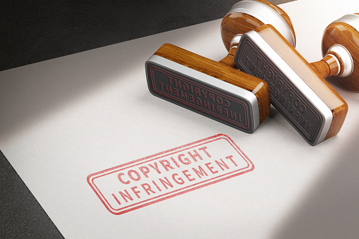 Copyright infringement letters and rubber stamps. 3d illustration