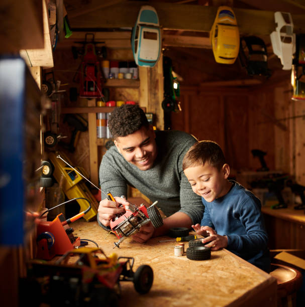 istock dad and son in the shed 1293750448
