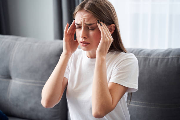 istock Girl feeling pain in head 1293751428