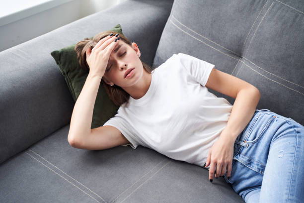 istock Woman suffering from headache 1293751431