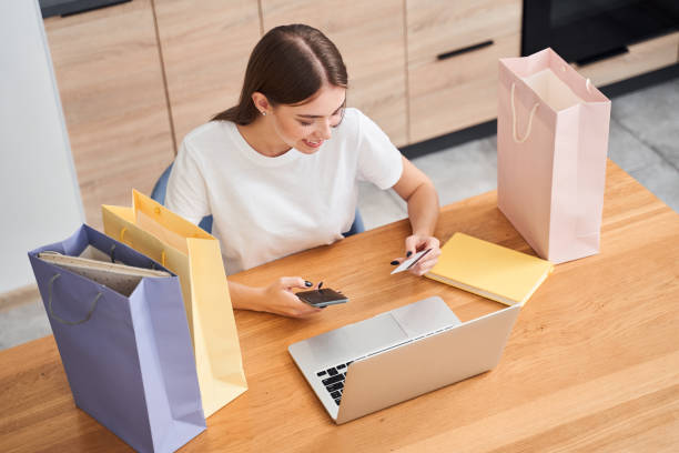 istock Woman looking at the credit card 1293751448