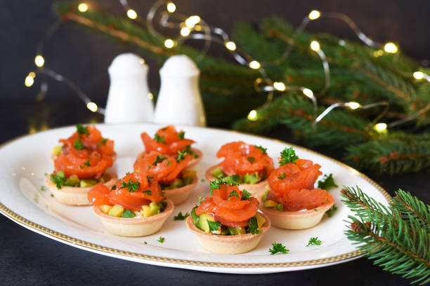 istock Snack with salmon and avocadon on New Year's table. 1293752394