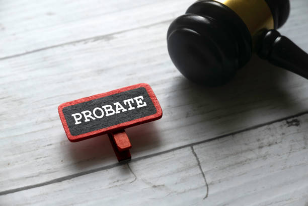 PROBATE Selective focus of gavel and red tag written with PROBATE on white wooden background. probate photos stock pictures, royalty-free photos & images