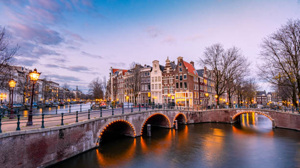 istock Amsterdam Netherlands during sunset, historical canals during sunset hours 1293755582