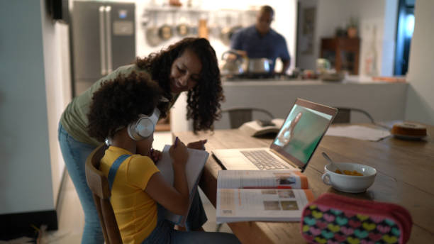 istock Mother helping daughter with homework 1293755806