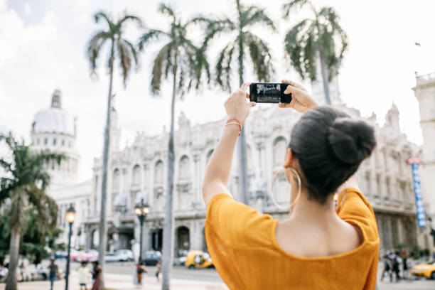 istock Woman taking pictures with smartphone 1293756734