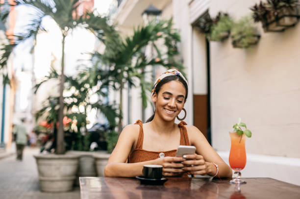 istock Woman texting on smart phone in city 1293756775