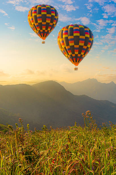 istock Mountain scenery with hot air balloons and beautiful sky 1293757764