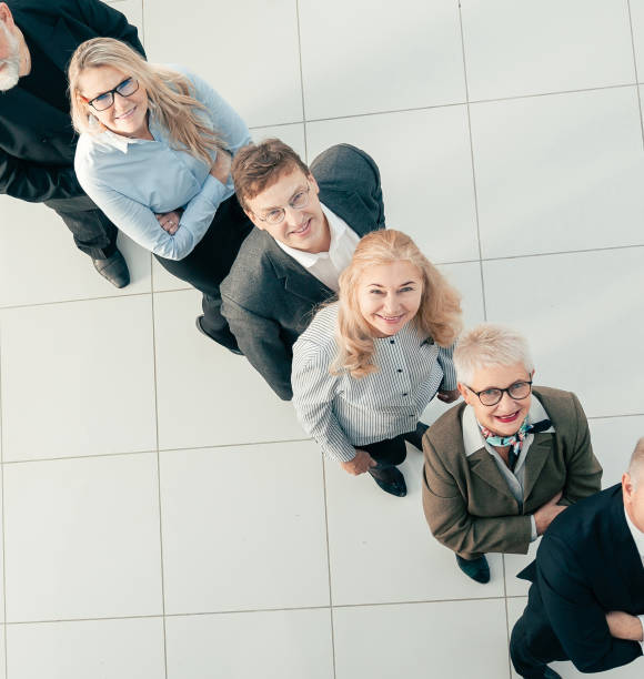istock top view. group of smiling business people standing in a row 1293757782