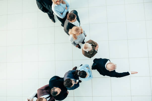 istock top view. a confident businessman leading his team forward 1293757799