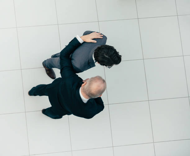 istock top view. reliable business partners standing together 1293757825