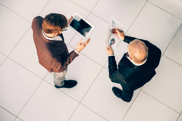 istock top view. business colleagues comparing financial data 1293758482