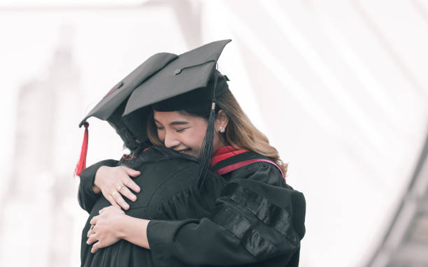 istock Two asian women happy with graduation 1293758510