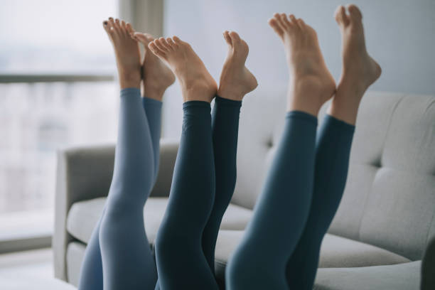 istock asian chinese legs with yoga pants resting on sofa 1293758789