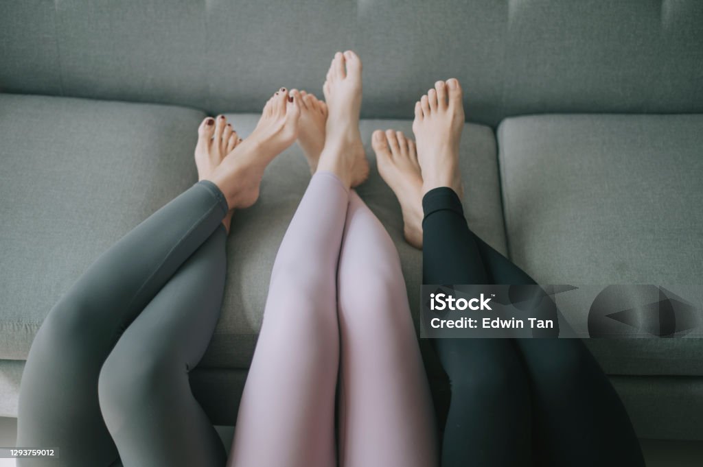 Asian Chinese Legs With Yoga Pants Resting On Sofa Legs Crossed Stock Photo  - Download Image Now - iStock