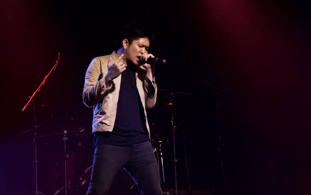 istock Asian male singer showing his performance on stage 1293762604