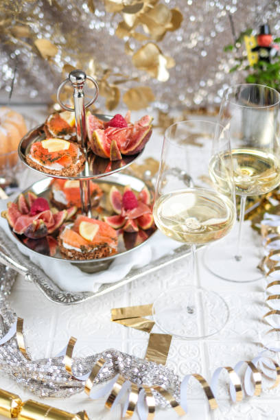 istock Festive Party Table with Seafood Appetizer Etagere Tower and Wine 1293763432