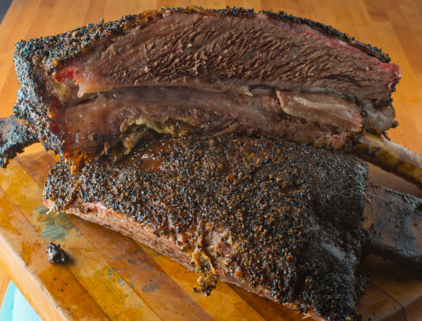 istock Beef ribs. Barbecue beef ribs served with classic bbq sides Mac n cheese, cornbread, Brussels sprouts, coleslaw and beer. Classic traditional Texas meats and side dishes. 1293763511