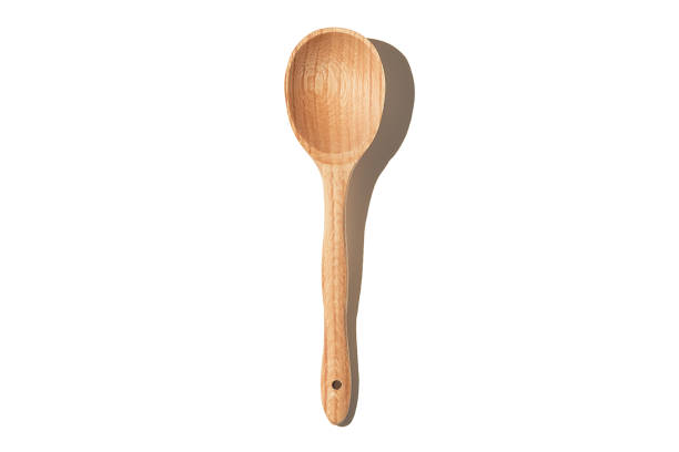 istock Wooden textured spoon isolated on a white background. 1293763513
