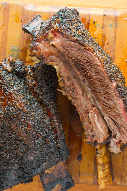 istock Beef ribs. Barbecue beef ribs served with classic bbq sides Mac n cheese, cornbread, Brussels sprouts, coleslaw and beer. Classic traditional Texas meats and side dishes. 1293763647
