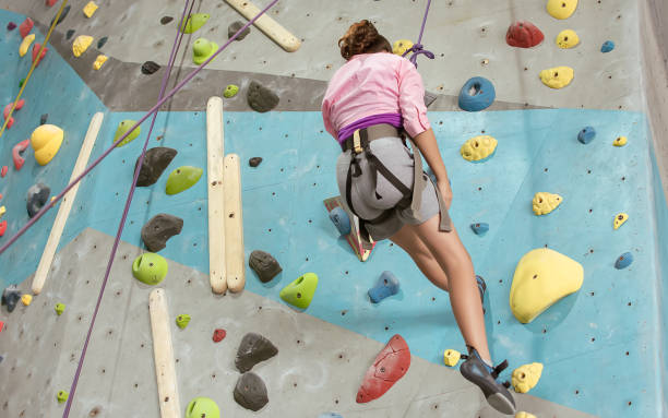 istock A girl climbing rock mountain 1293764577