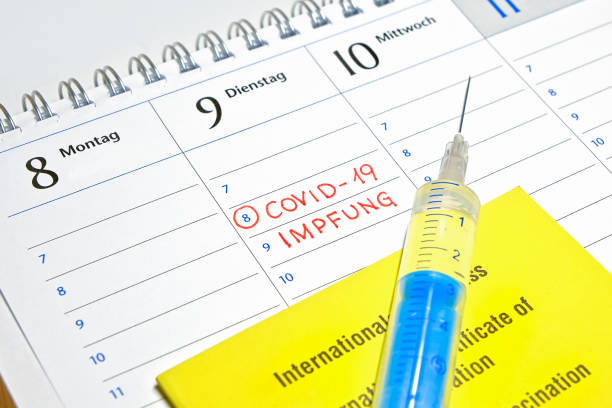 istock Note in the calendar - Appointment for SARS-CoV-2 / COVID-19 Vaccination - German language 1293766585