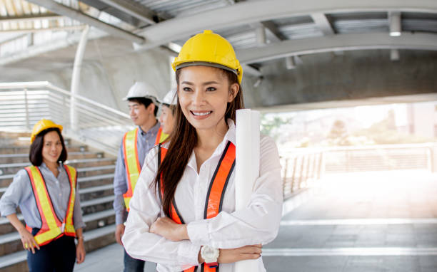 istock Portrait of female engineer standing in construction site 1293770629