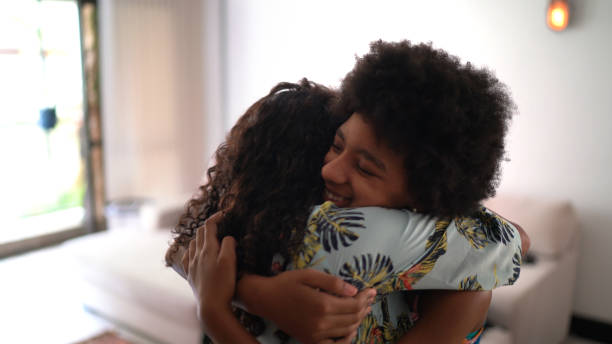 istock Mother embracing daughter at home 1293773672