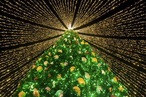istock Christmas tree covered with garlands ribbons 1293778160