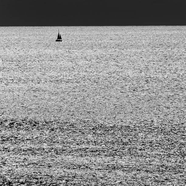 istock Sailing boat on glittering sea 1293779231