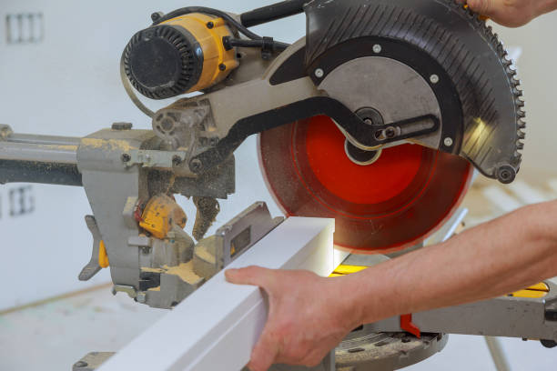 istock Close up of Circular saw cutting sharp rotary blade new baseboard woodwork 1293782387