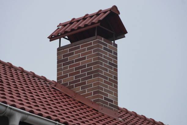 istock one brown brick chimney on red tiles on the roof 1293786660