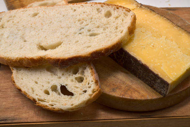 istock French cheese and bread on a wooden board 1293788445