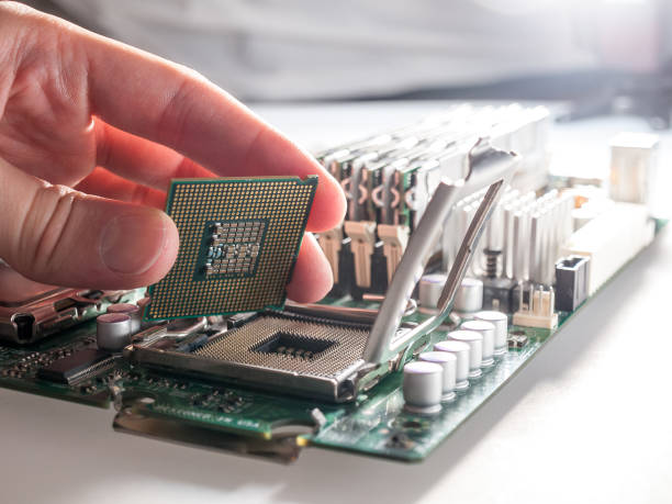 istock the process of connecting the CPU to the processor socket on a modern computer motherboard, replacing the silicon data processing chip, and correctly installing the central processing unit 1293793959