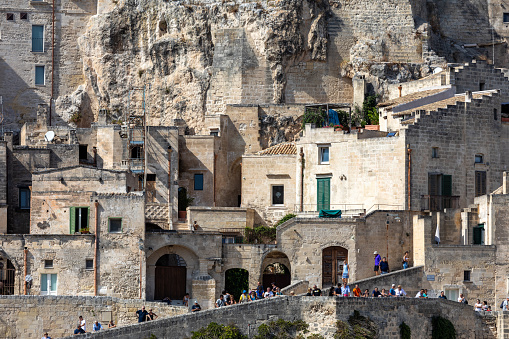Matera, Italy - September 15, 2019: View of the Sassi di Matera a historic district in the city of Matera, well-known for their ancient cave dwellings. Basilicata. Italy