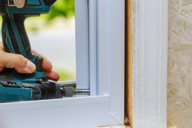 istock Installation and assembly of plastic window for apartment interior uses an electric drill 1293794831