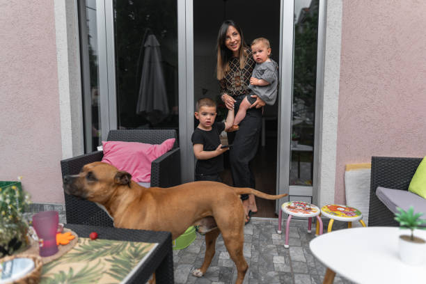 Family in back yard with dog