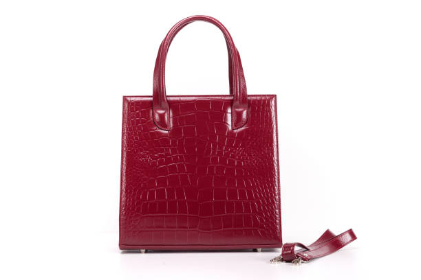 istock red womens designer handbag on a white background 1293798620