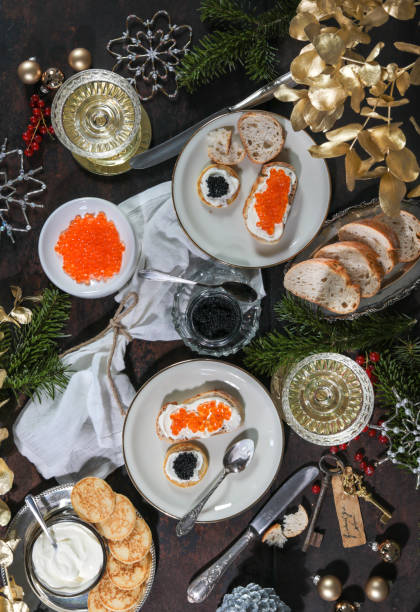 istock Festive Christmas Table with Caviar Blinis and Champagne 1293801576