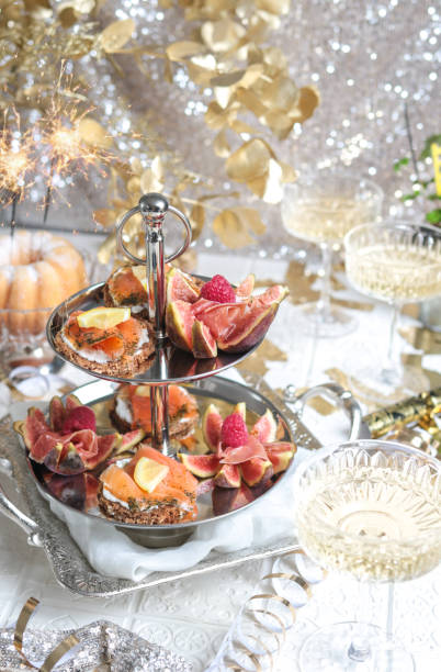 istock Festive Party Table with Seafood Appetizer Etagere Tower and Champagne 1293802246