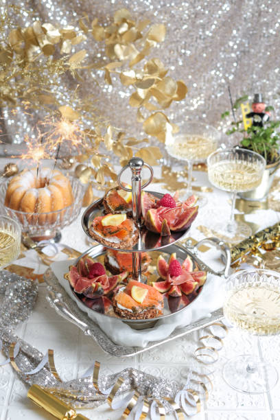 Festive Party Table with Seafood Appetizer Etagere Tower and Champagne