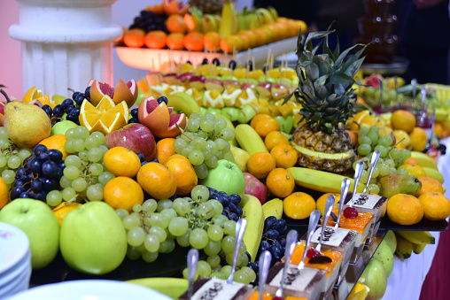 Organic fruits. Healthy eating concept. Close up of a fresh fruits on a buffet.