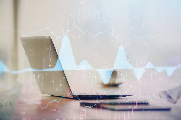 istock Multi exposure of graph and financial info and work space with computer background. Concept of international online trading. 1293807242