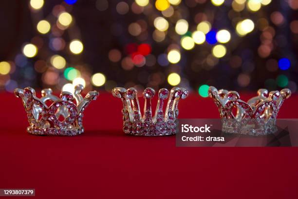 Three Silver Crowns Symbol Of Tres Reyes Magos On Colorful Bokeh Background Stock Photo - Download Image Now