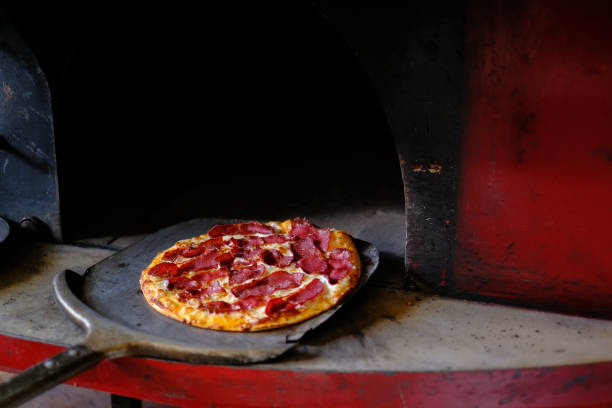 istock Hot meat pizza ready to serve from the stone oven 1293807520