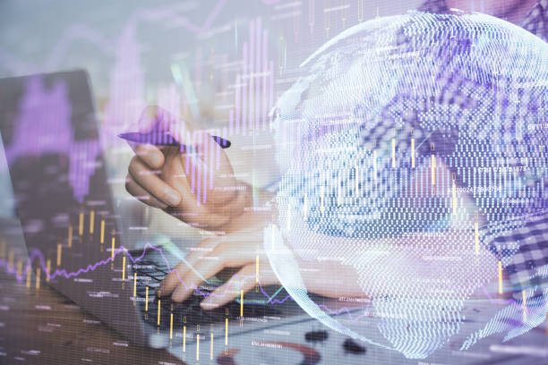 istock Multi exposure of forex graph with man working on computer on background. Concept of market analysis. 1293808143
