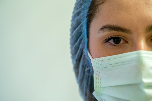 photo of the face of the covid virus intensive care nurse stock photo